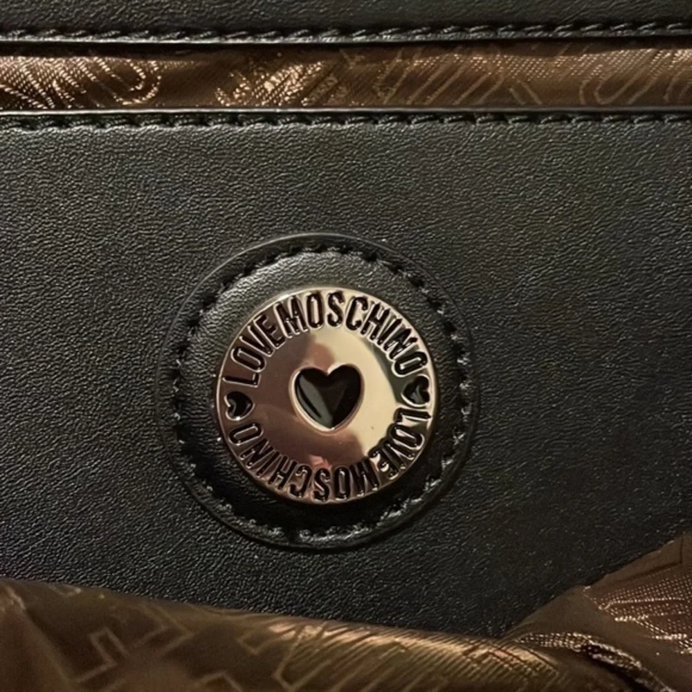 LOVE  MOSCHINO Black logo and fringe backpack